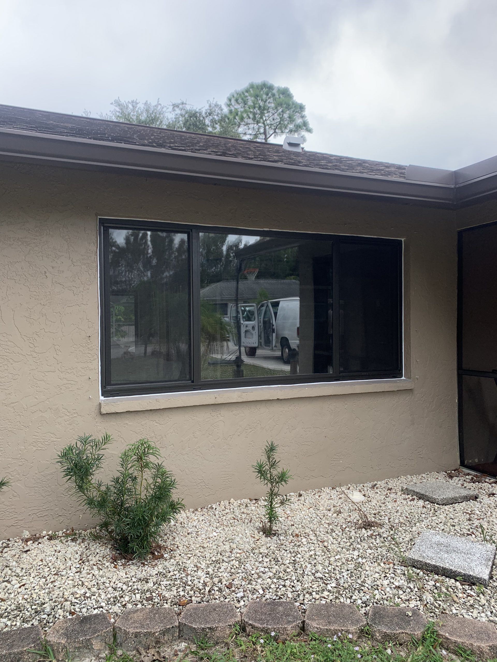 Newly installed impact window and screen in Cape Coral, FL residential home.