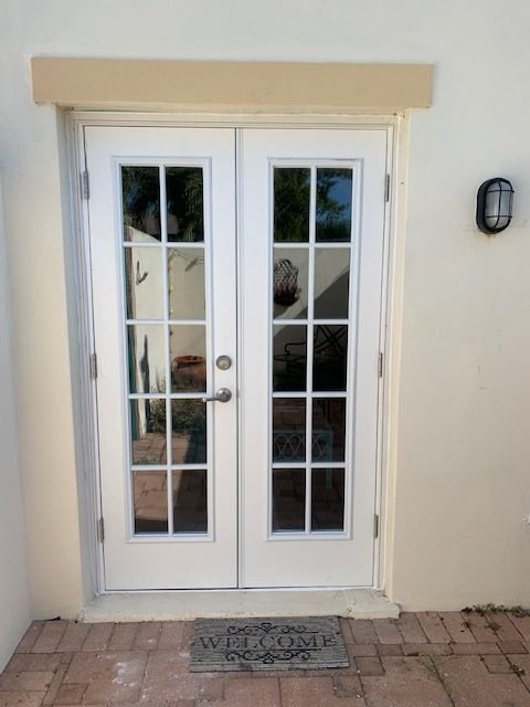 White French doors installation in Cape Coral, FL, showcasing residential door projects.