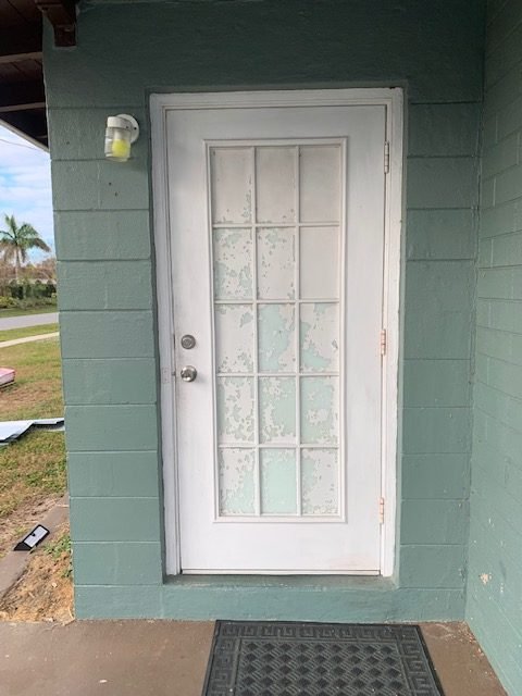 White paneled door installation project in Cape Coral, FL.